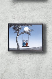 Hand-Painted Pebble Art — Family on the Swing by Moonlight Pebble Art · Hand-Painted · Framed · One of a Kind